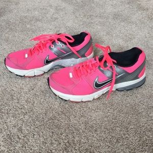 Hot pink Nike tennis shoes
